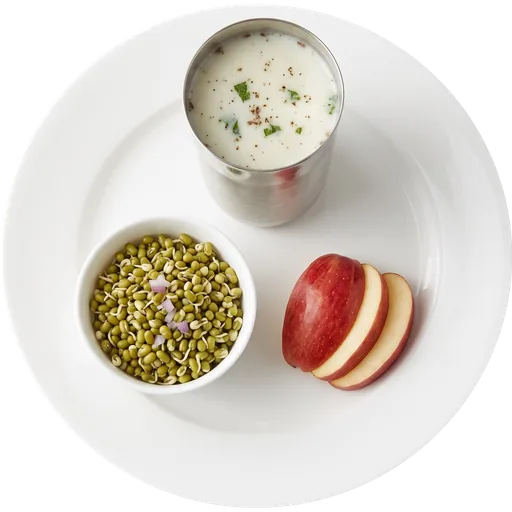 Chaas with sprouts and a fruit on a white plate