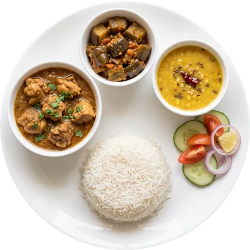 Chicken curry with rice, dal and salad on a white plate