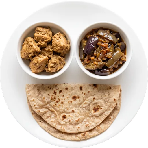 Chicken with baingan sabzi and roti on a white plate