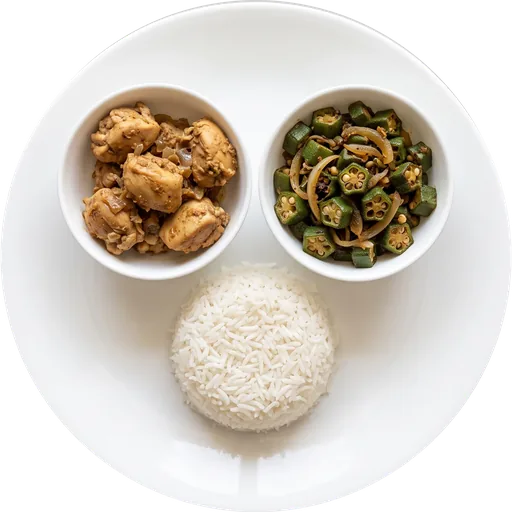 Chicken with bhindi sabzi and rice on a white plate