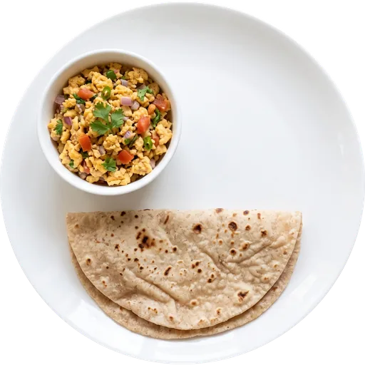 Egg bhurji with roti on a white plate
