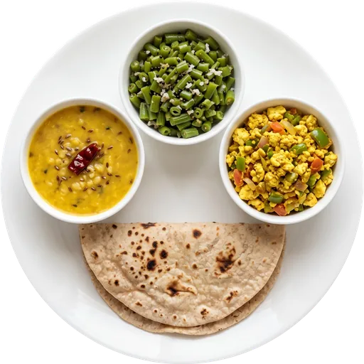 Paneer bhurji with beans, dal and roti on a white plate