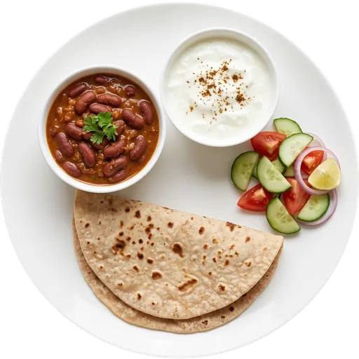 Rajma with roti, curd and salad on a white plate