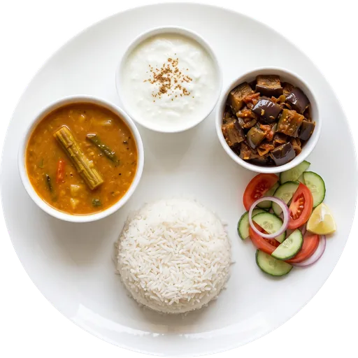 Rice with sambar, baingan sabzi and curd on a white plate