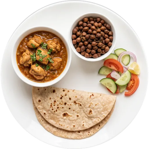 Roti with chicken curry, chana and salad on a white plate