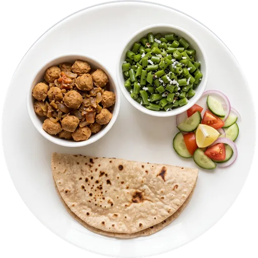 Soya chunks with beans, roti and salad on a white plate
