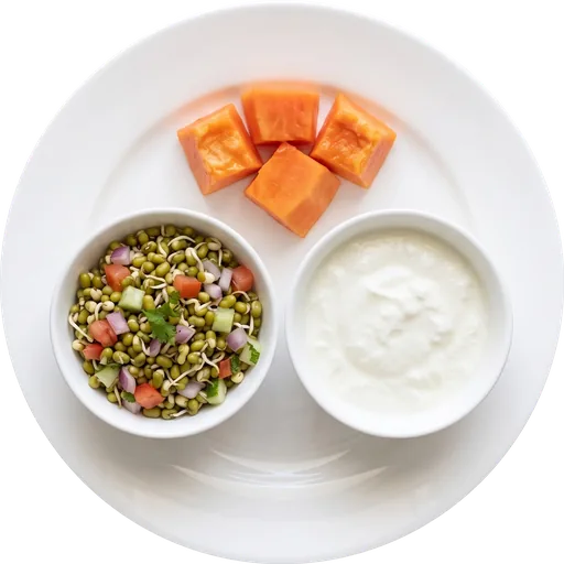 Sprouts chaat with curd and a fruit on a white plate