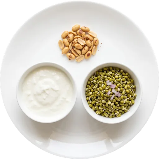 Steamed sprouts with curd and peanuts on a white plate